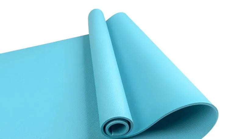 Red EVA yoga mat with textured anti-skid surface, shown rolled and unrolled.