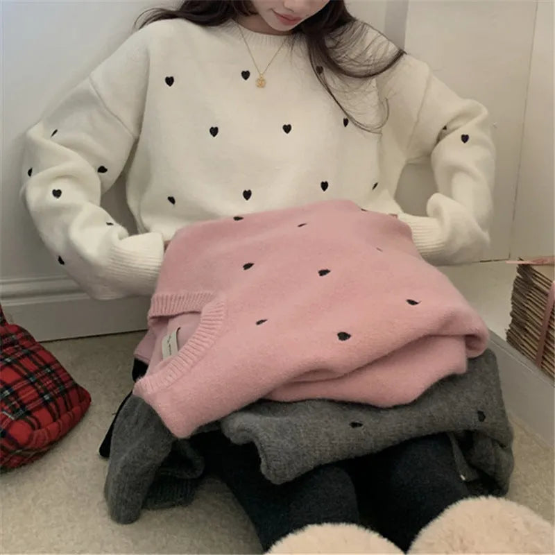 Women's loose fit long sleeve acrylic pullover sweater with love embroidery in milky white.