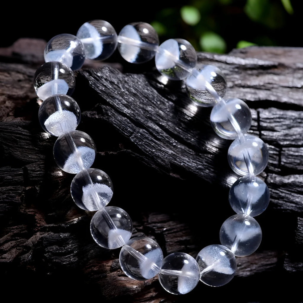 Women's natural white crystal pyramid ghost bracelet with Ruyi charm showing bead texture
