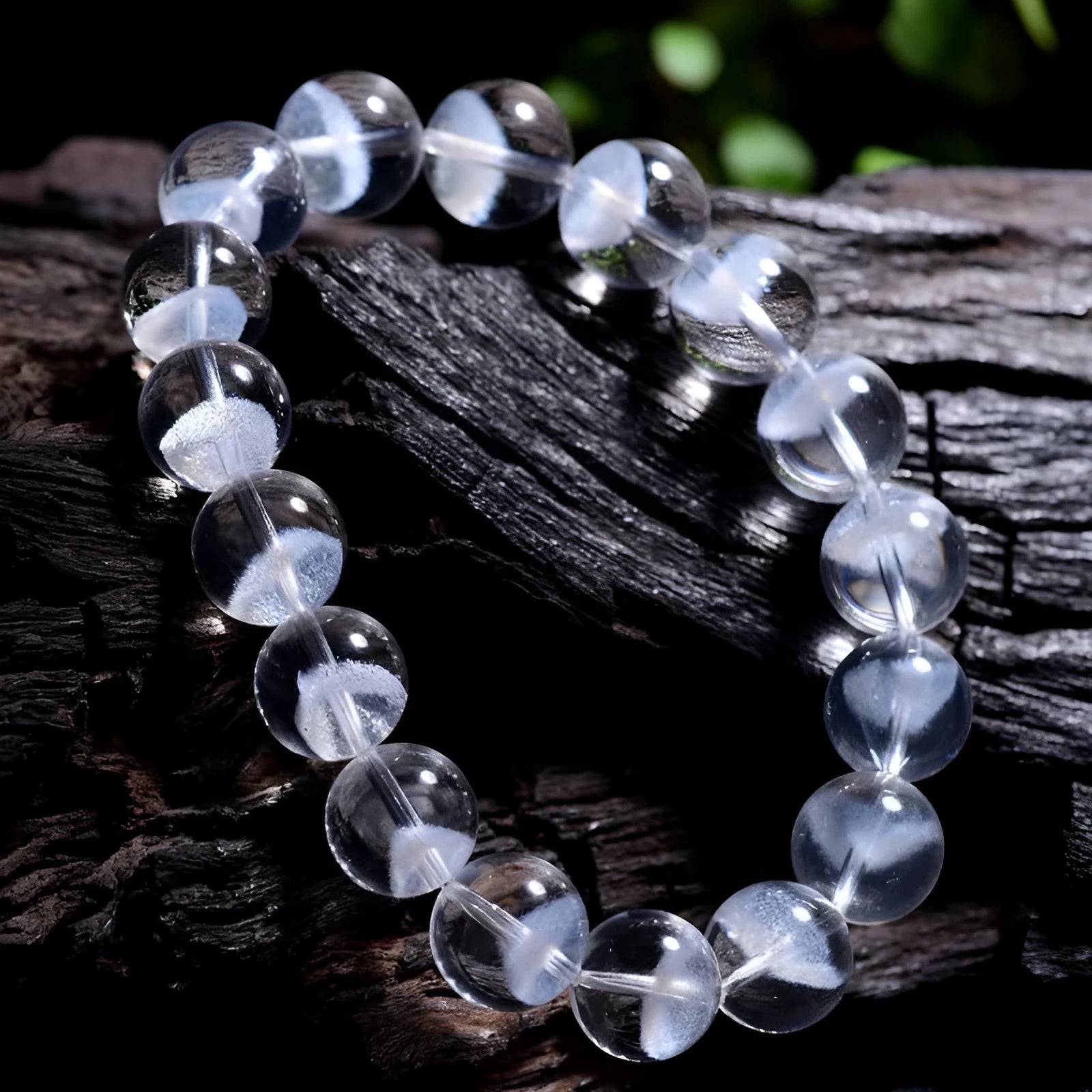 Women's natural white crystal pyramid ghost bracelet with Ruyi charm showing bead texture