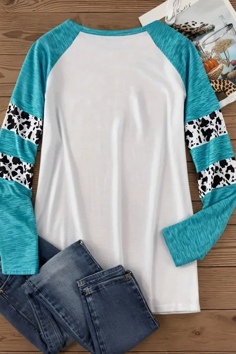 Sky blue Halloween t-shirt featuring a large white 3D digitally printed pumpkin design on the front.