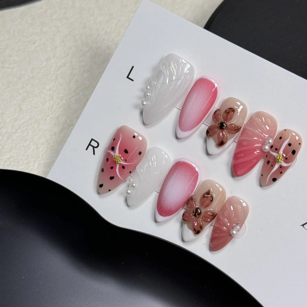 Hand-painted three-dimensional embossed nail art patches in candy colours, showing almond shape.