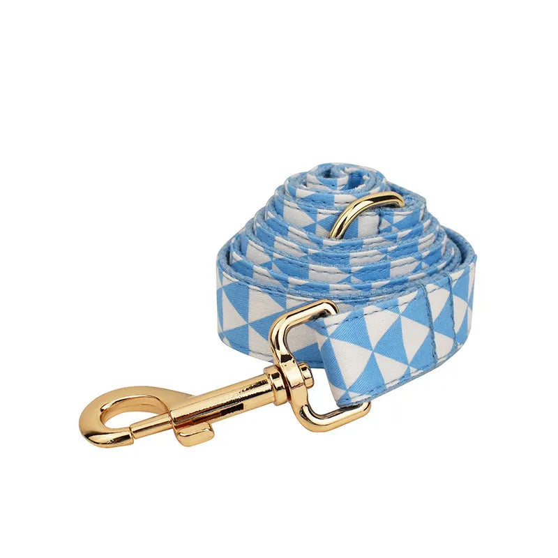 Blue cloth dog accessory set showing vest, collar, leash, and bow for small to medium breeds
