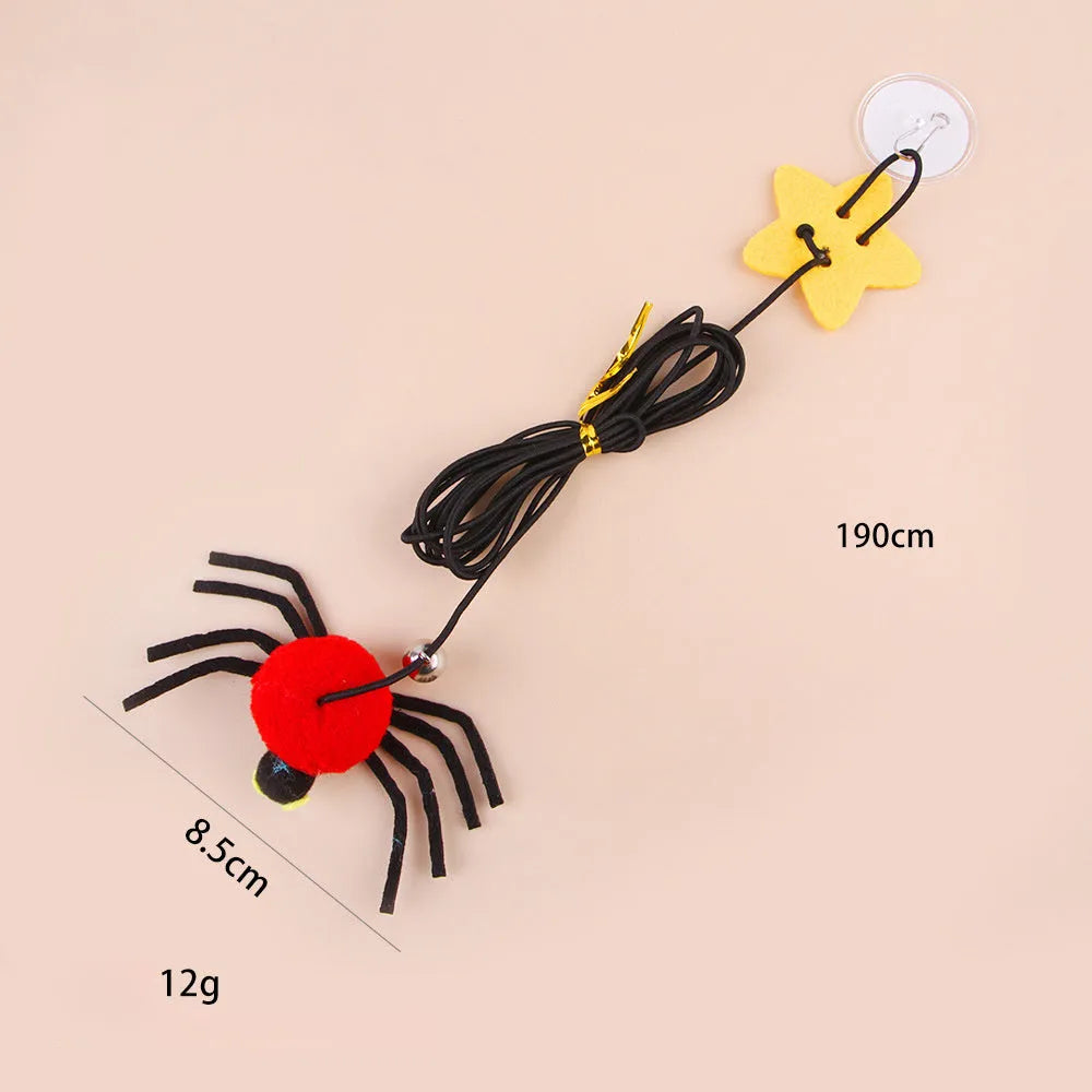 Cat hanging door toy with red feather and bell spider dangling from elastic rope