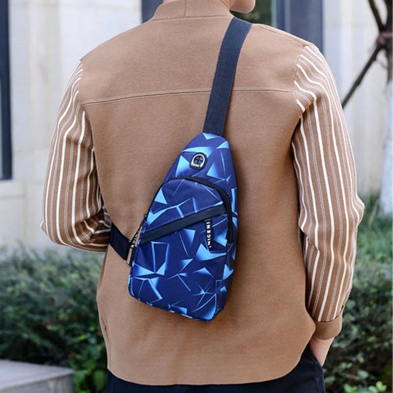 Men's Oxford cloth sling chest bag with earphone hole showing crossbody strap and zipper closure