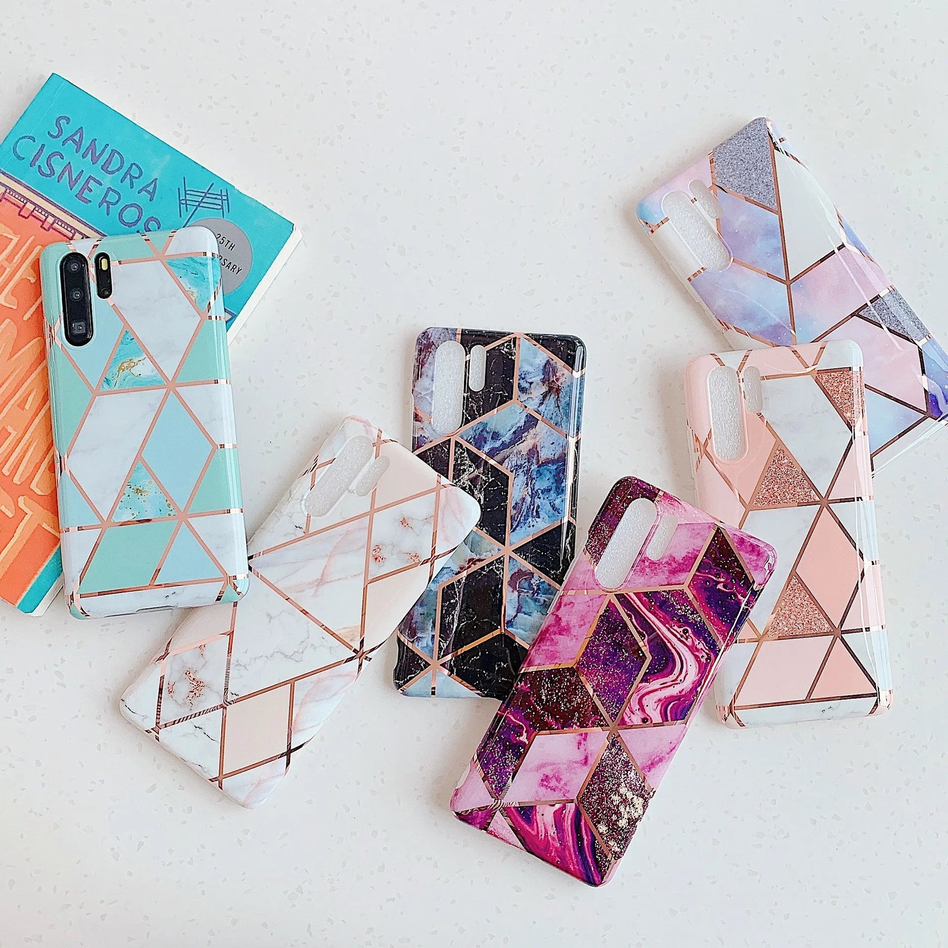 Glossy electroplated marble design TPU back cover case for a Huawei smartphone.