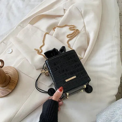 Women's small one shoulder messenger bag with chain strap in bucket style design