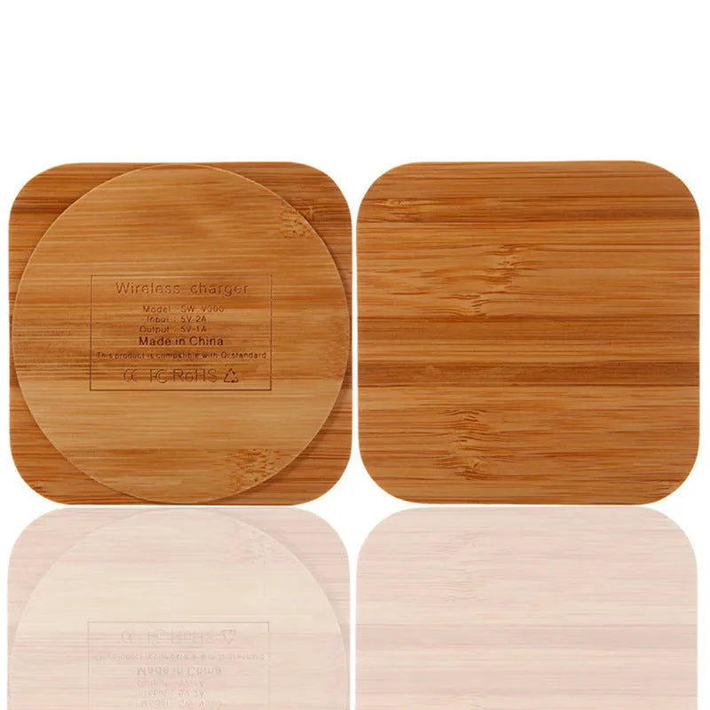 Square wooden bamboo 5W Qi wireless charging pad on a desk.