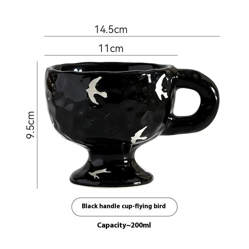 Hand-pinched irregular ceramic mug in a solid colour, showing unique handmade shape.