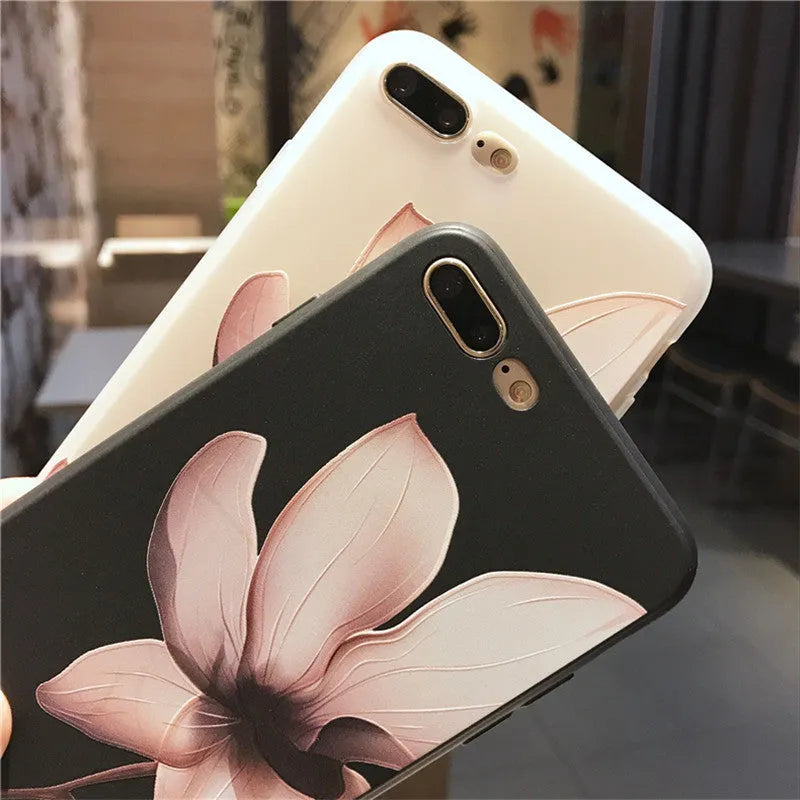 Embossed single flower design on black TPU iPhone case showing back cover protection