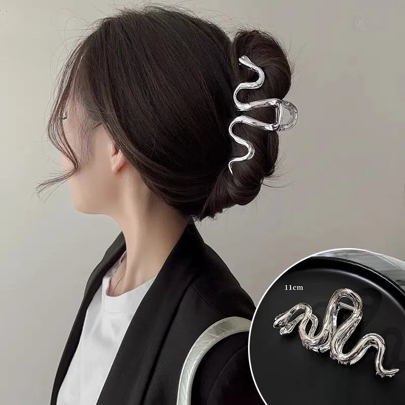 Silver Slytherin serpentine metal hair barrette measuring 10.5 cm in length.
