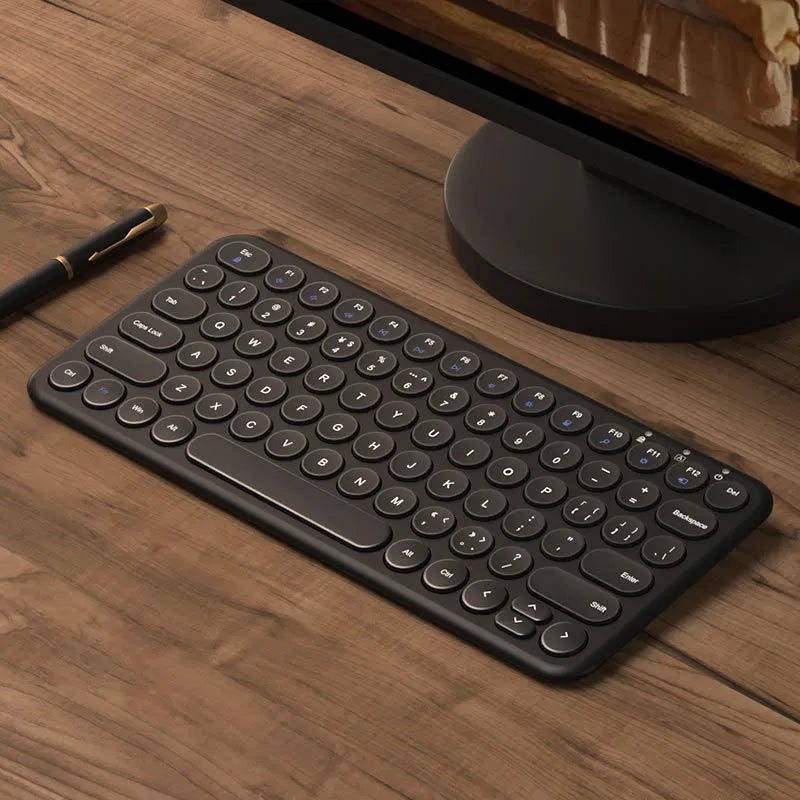 White ultra-thin wireless keyboard and mouse set with USB receiver and keyboard film on desk