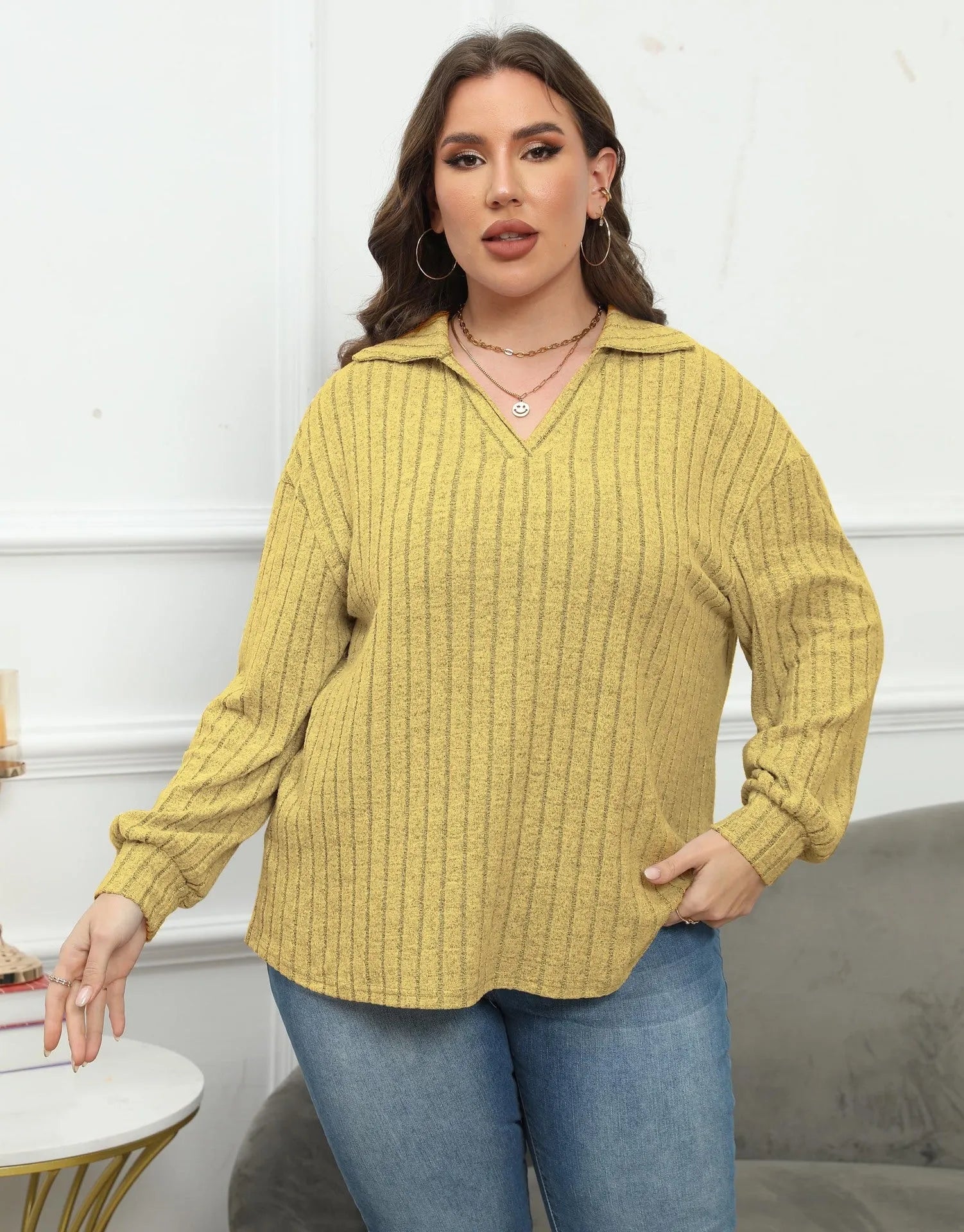 Women's plus size grey polo collar fleece shirt with lantern sleeves on a hanger
