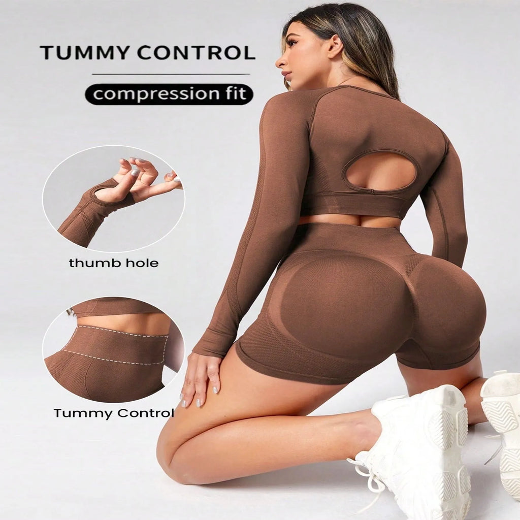 Women's black yoga suit set with long sleeve top and high-waisted tights on a mannequin.