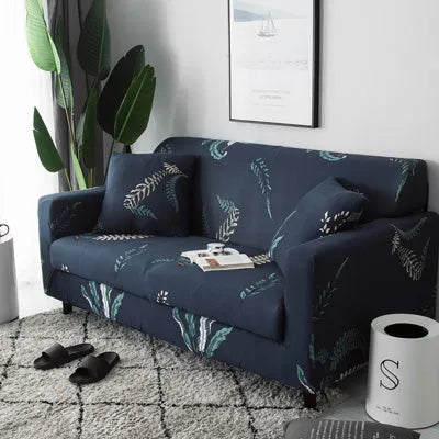 Printed stretch sofa cover with geometric pattern on three-seater sofa