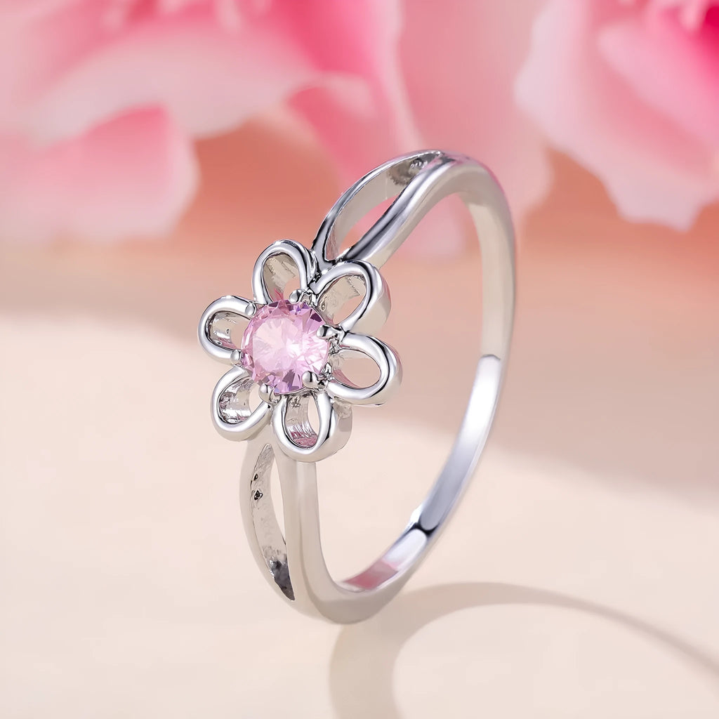 Copper flower hollow-out fashion ring for women with platinum pink diamond plating.