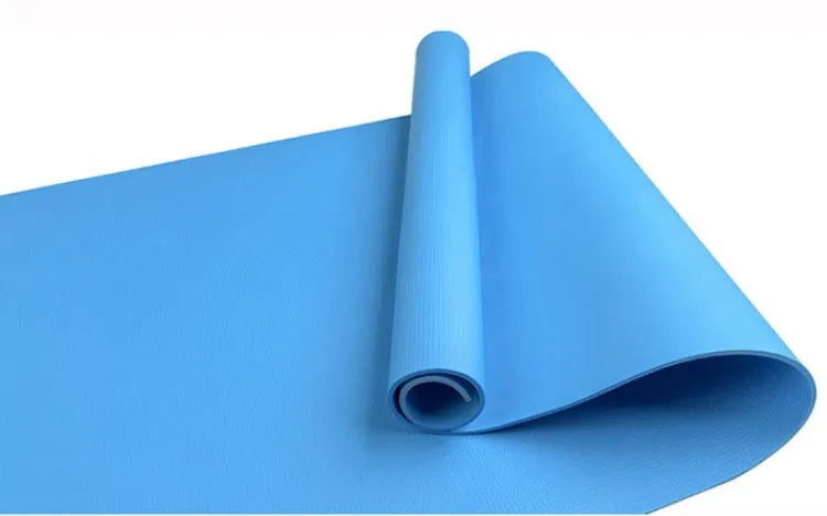 Red EVA yoga mat with textured anti-skid surface, shown rolled and unrolled.