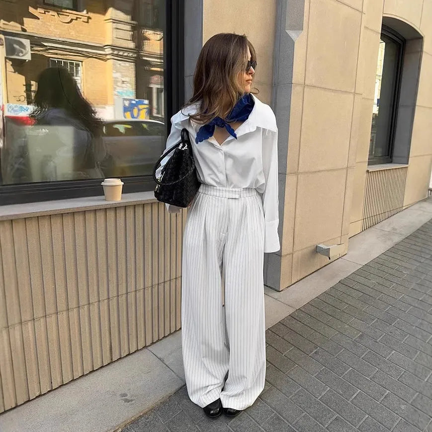 White striped wide-leg women's trousers with front zipper in loose casual fit