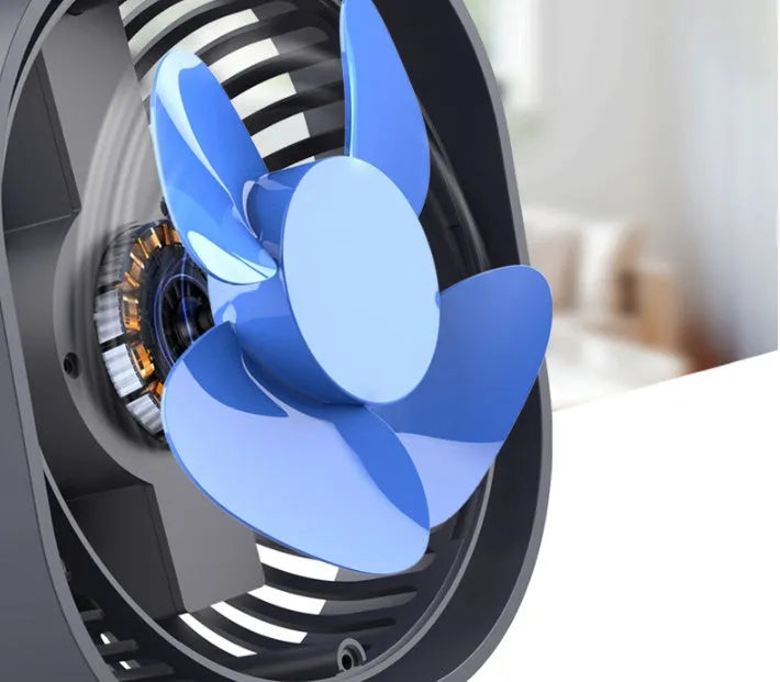 USB desk fan with rotating head in modern alarm clock style on a desk.