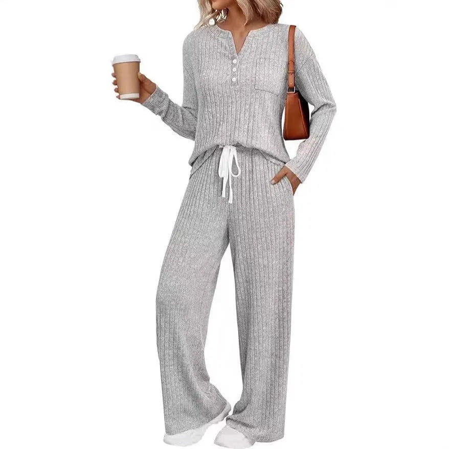 Women's striped knit V-neck long coat in light grey with matching pants, showing lace-up details
