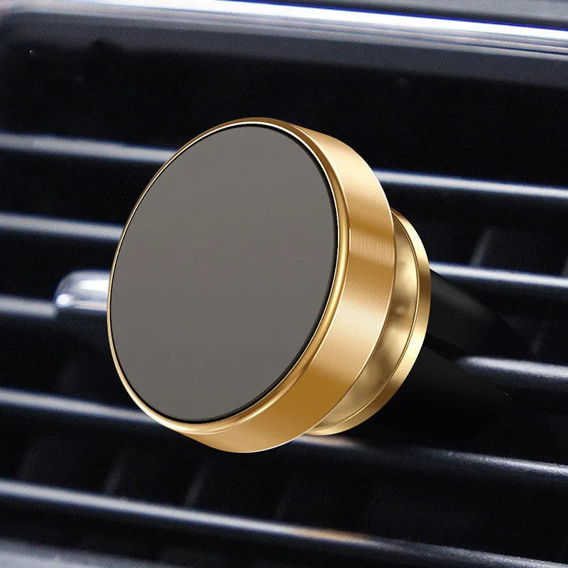 Magnetic car phone holder with aluminium alloy cradle shown in black, mounted on a car air vent.