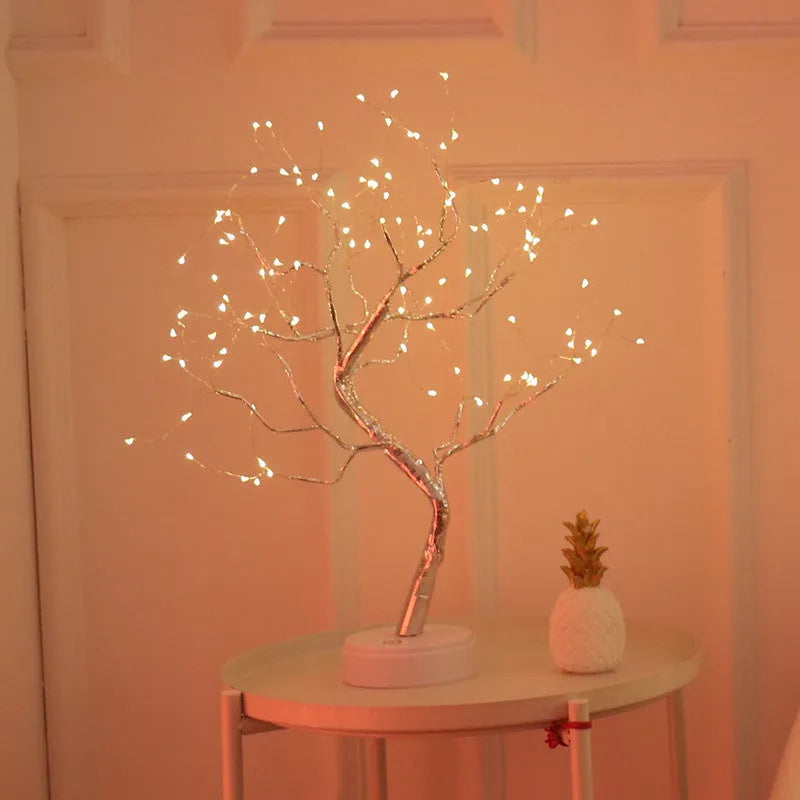White LED Christmas tree shaped night light with touch base, standing 50cm tall on a table.