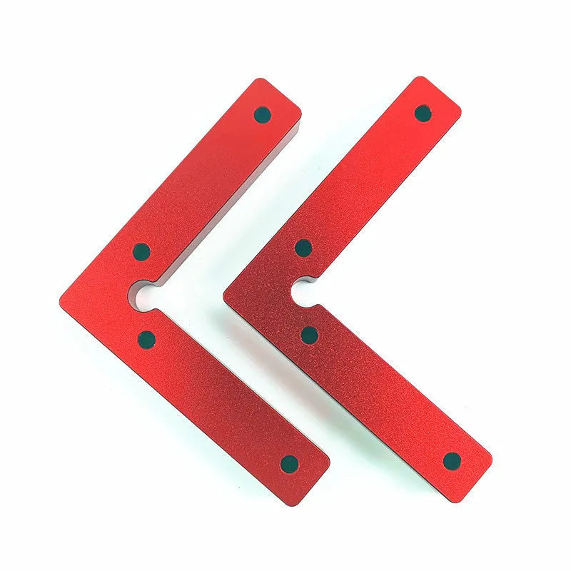 Aluminum alloy woodworking right angle positioning block on a workbench.