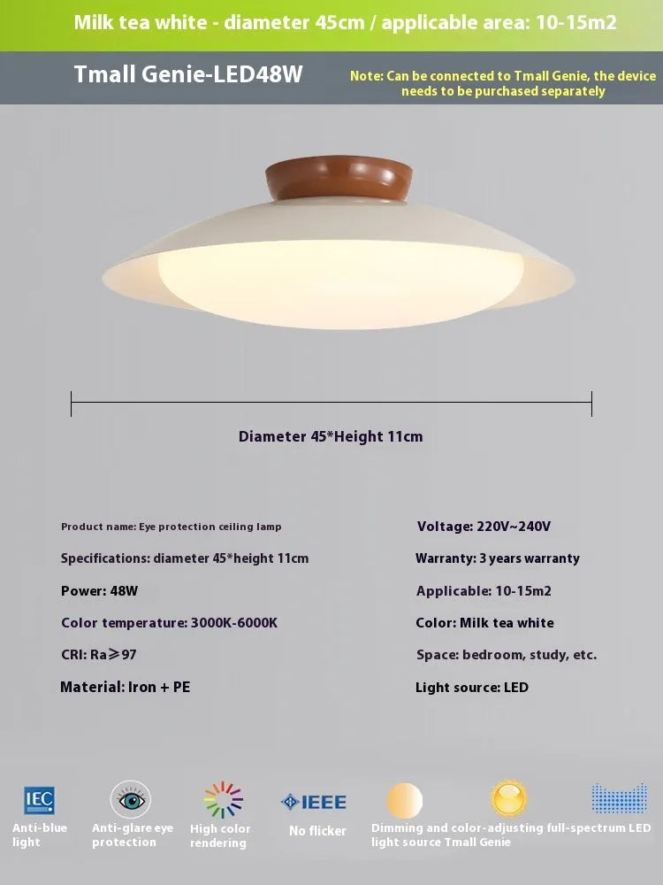 Modern flying saucer shaped ceiling lamp with an iron shade, shown in a cream yellow finish.