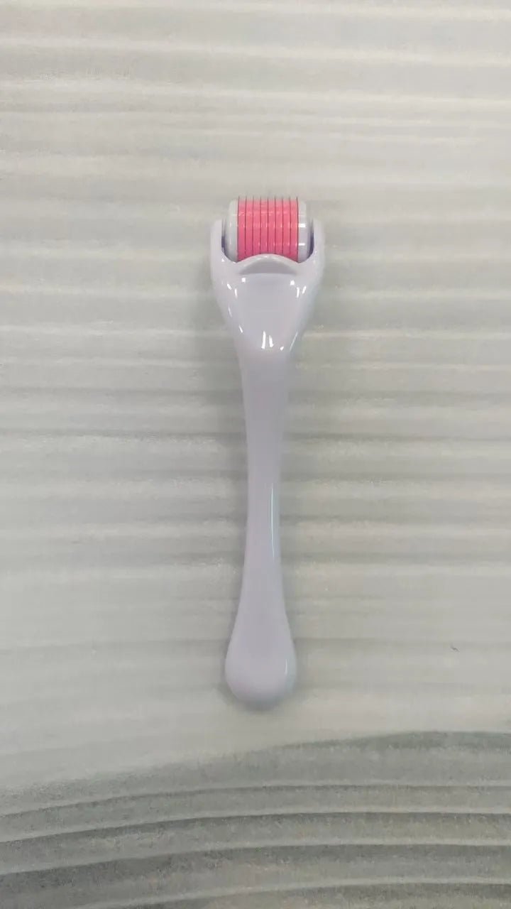 540 needle micro roller dermaroller with black handle and purple wheel, showing needle depth settings.