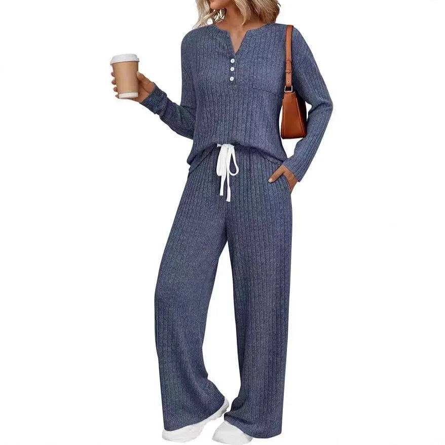 Women's striped knit V-neck long coat in light grey with matching pants, showing lace-up details