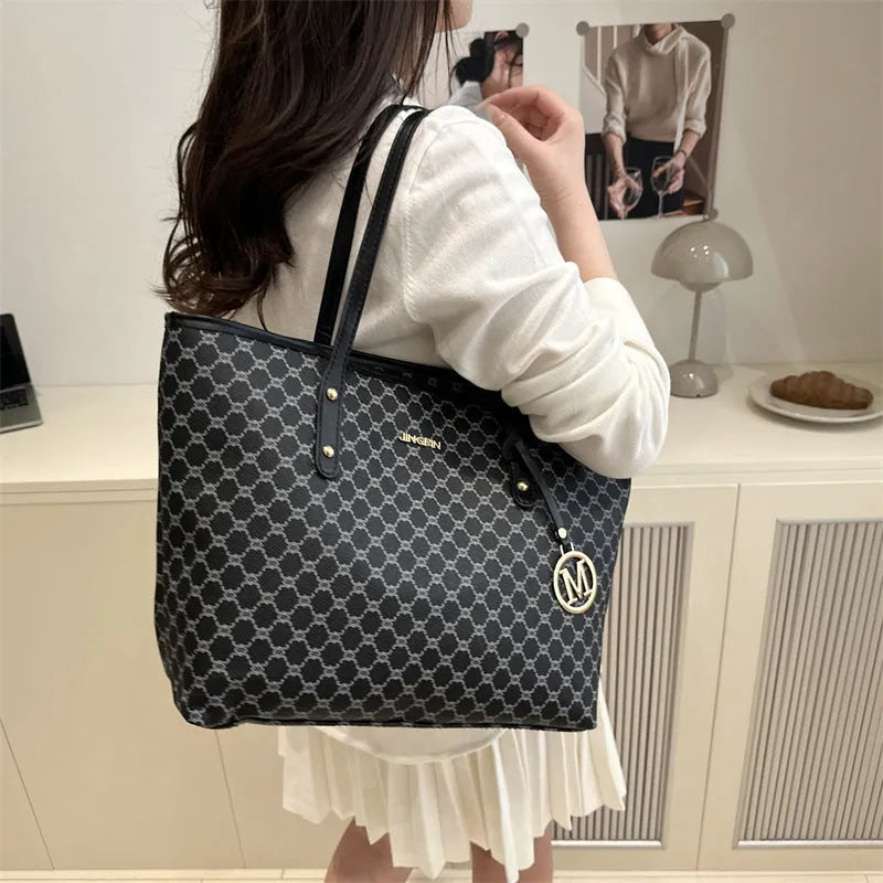 PU leather street trend shoulder bag with sewing thread detail in a choice of colours.