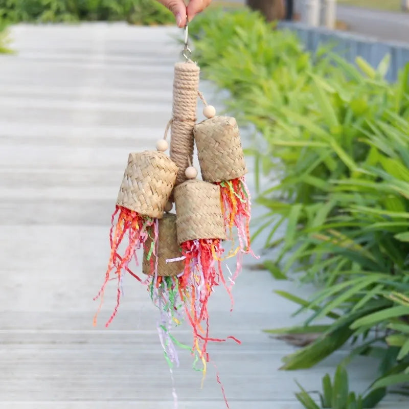 Colourful shredded paper bird toy with wood pieces and sisal fibres for parrots