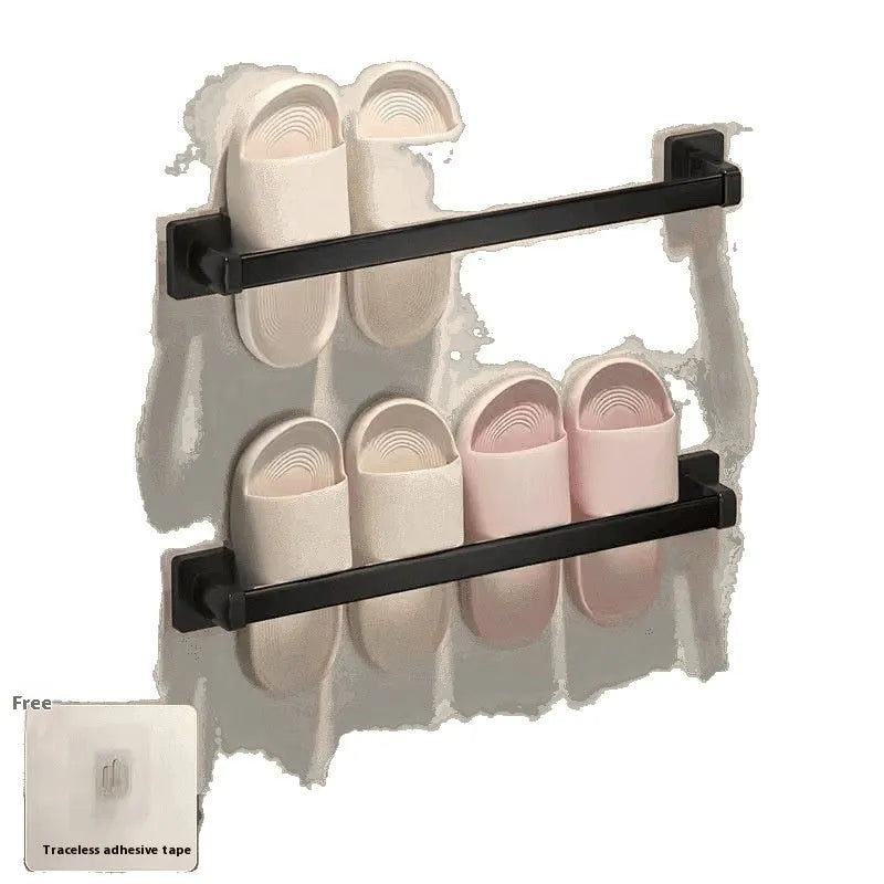 Black wall-mounted slipper rack with a small seat, shown holding two pairs of slippers.