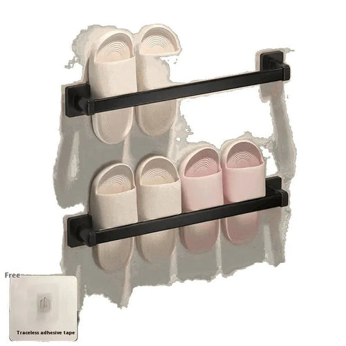 Black wall-mounted slipper rack with a small seat, shown holding two pairs of slippers.