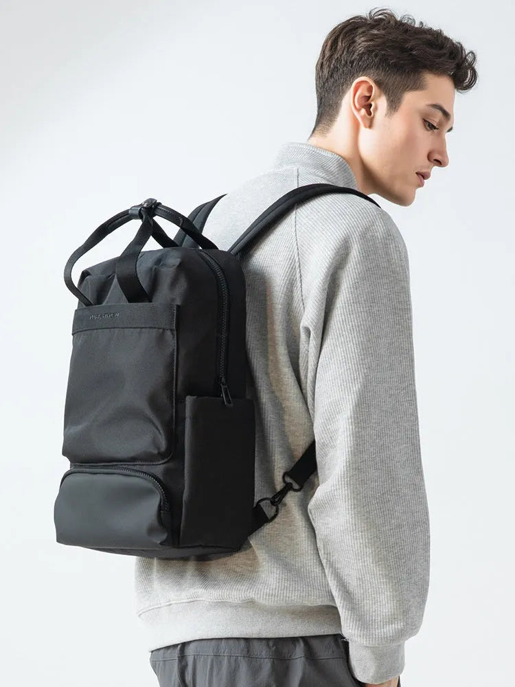 Black Oxford cloth laptop backpack with 20-35L capacity and multiple storage compartments