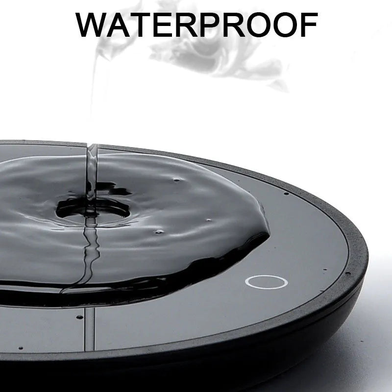 Black coffee mug warmer on a desk with low and high temperature switch