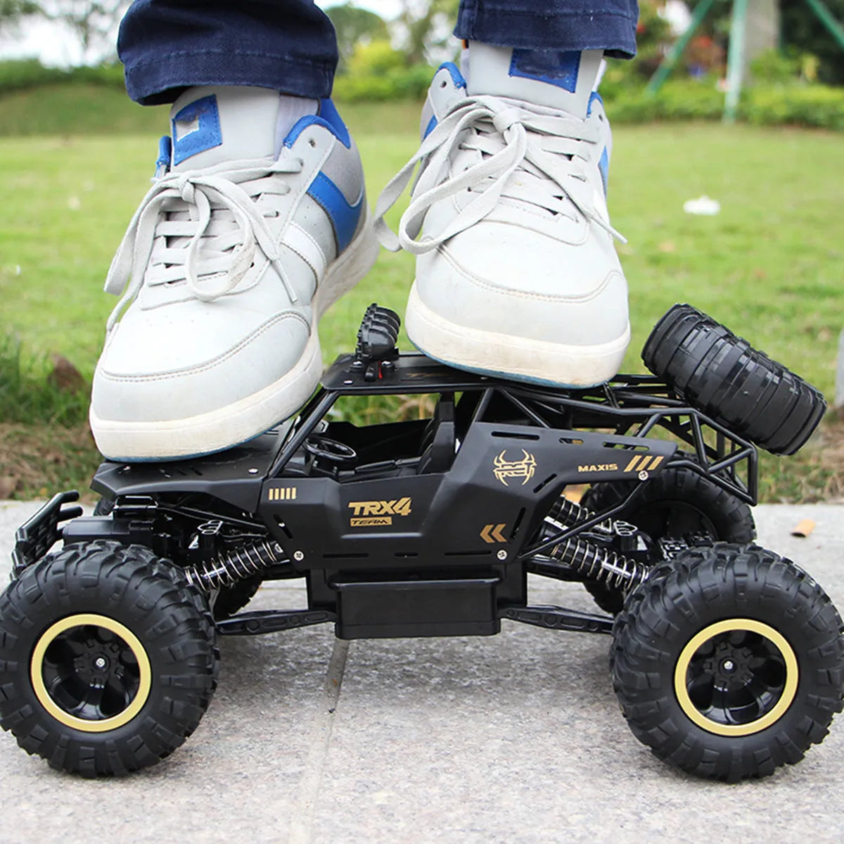 Large 4WD remote control climbing car with 2.4G wireless remote on off-road terrain