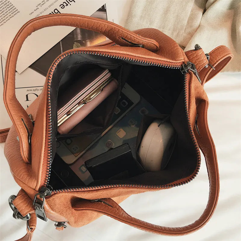 Soft PU leather women's tote shoulder bag with large capacity and zip closure in black, brown, or grey colour options