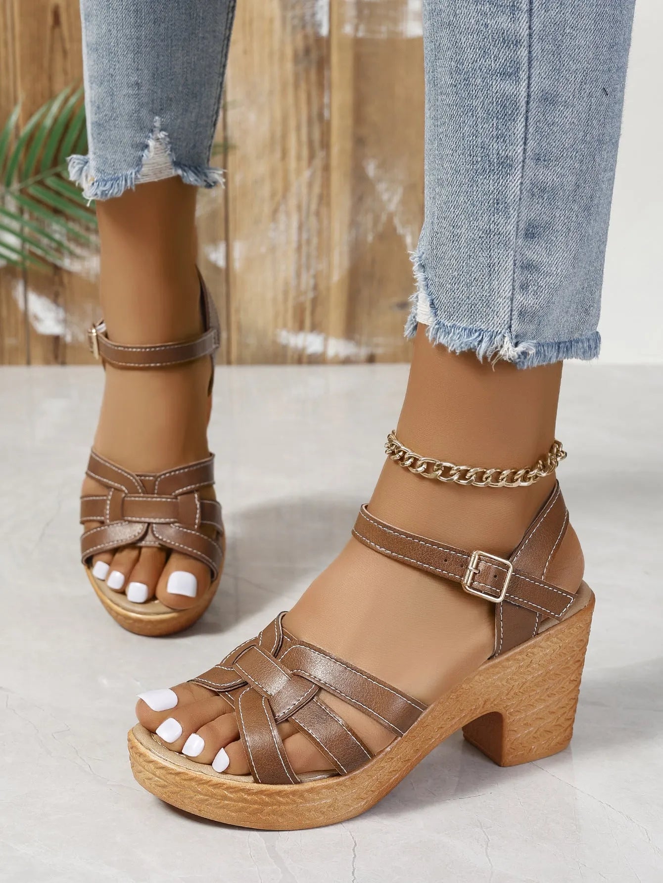 Plus size Roman women's peep toe chunky heel buckle sandals in black on white background