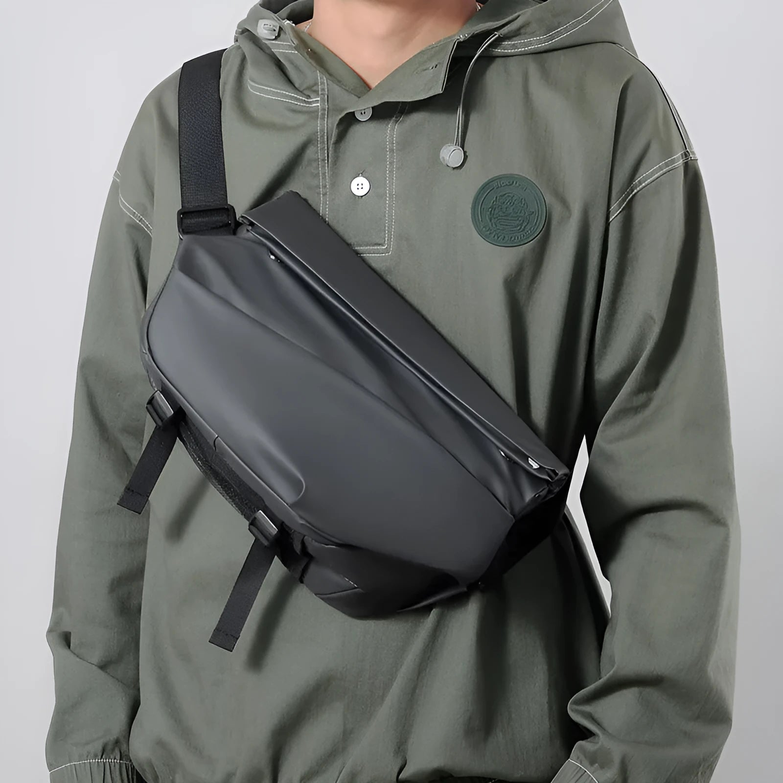 Men's grey crossbody bag showing internal phone pocket and document compartment with shoulder strap