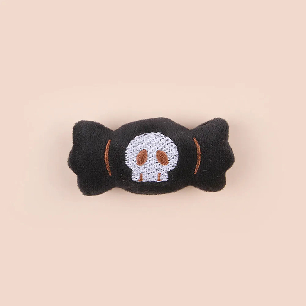 Colourful plush cat tease stick with candy, eyes and skull designs on small wand toy