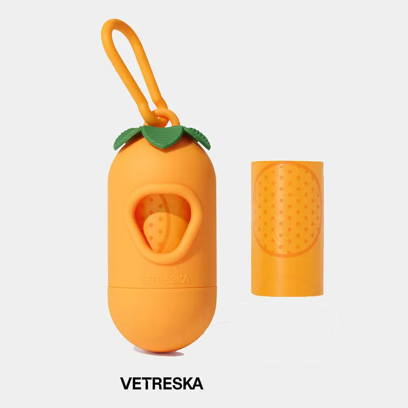 Portable dog poo bag dispenser capsule with strawberry design and a roll of scented biodegradable bags.