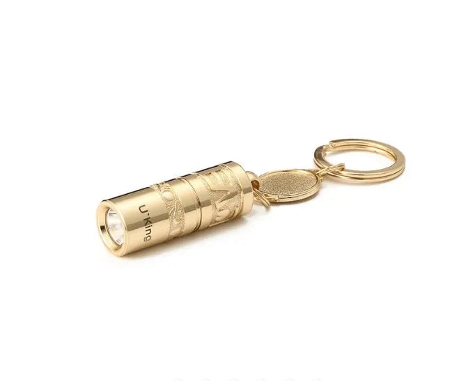 Gold zinc alloy waterproof LED flashlight attached to keychain with compact portable design
