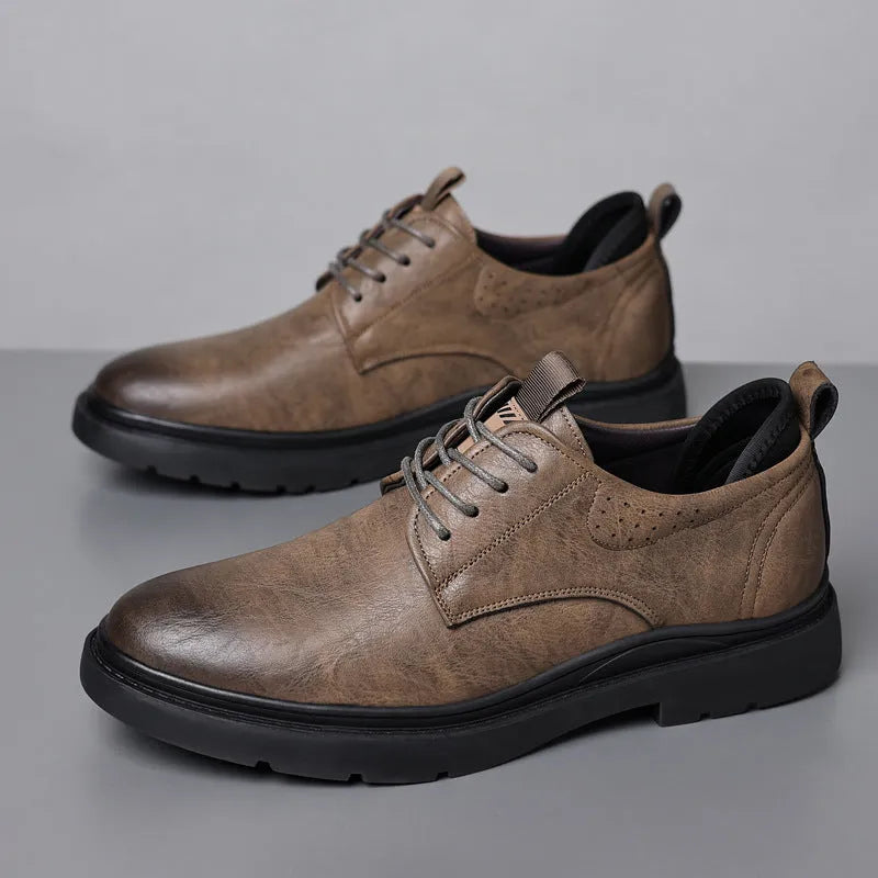 Men's black and brown cowhide leather sneaker shoes with rubber soles and decorative sewing lines.