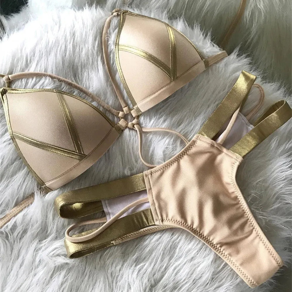 Women's bronzing bikini swimsuit with removable pads and cotton lining on a mannequin.