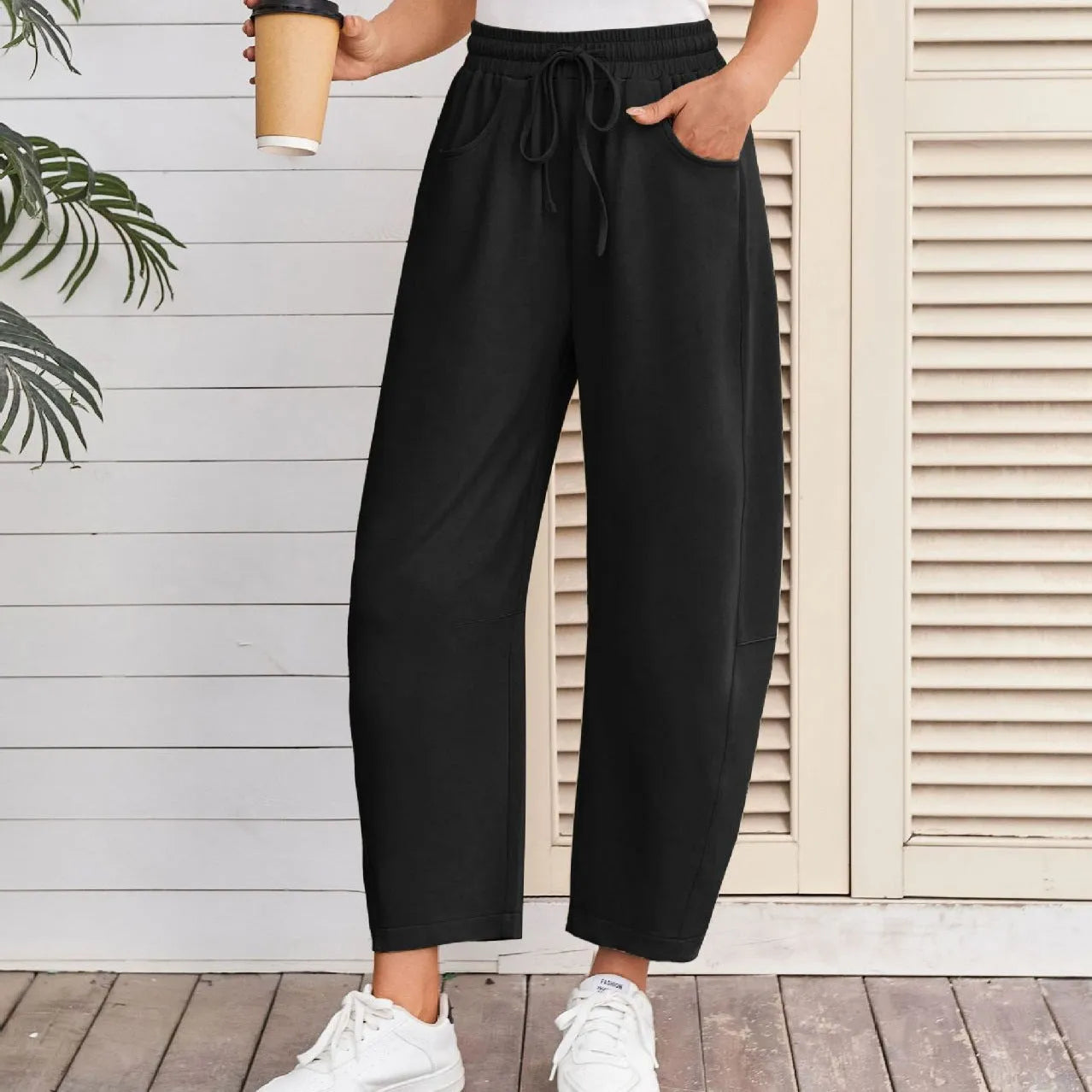 Loose cropped cotton sweatpants with elastic drawstring waist and side pockets in multiple colour options