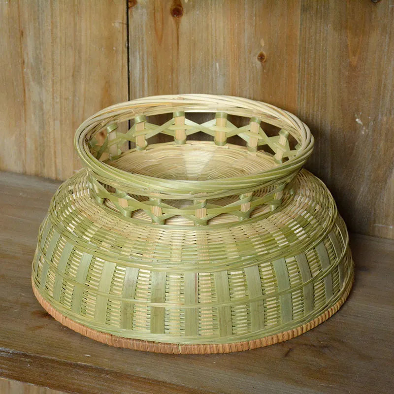 Handmade natural bamboo storage basket shown in one of three size options for household organisation.