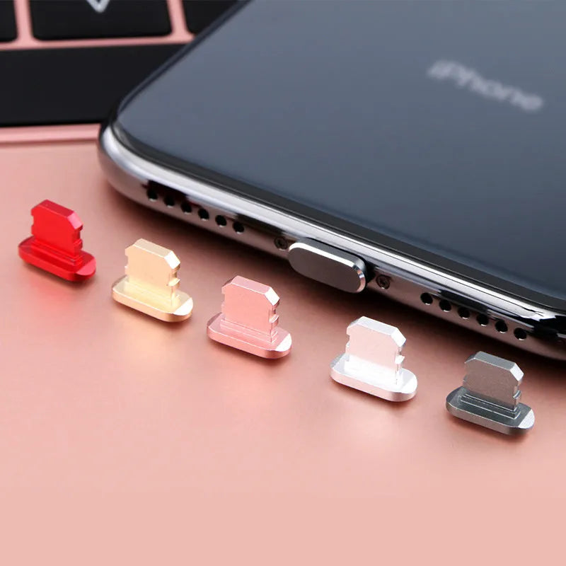 Aluminium alloy charging port dust plug for iPhone in various colours including gold, silver, blue, and rose gold.
