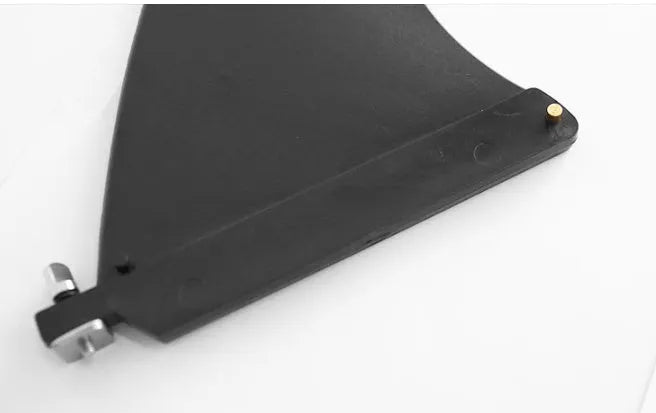 SUP paddle with large removable fish fins showing screw attachment mechanism