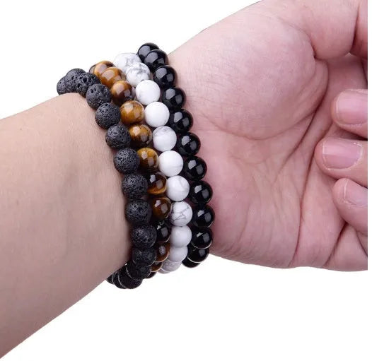 Geometric black agate stretch bracelet with 8mm beads on an elastic cord.
